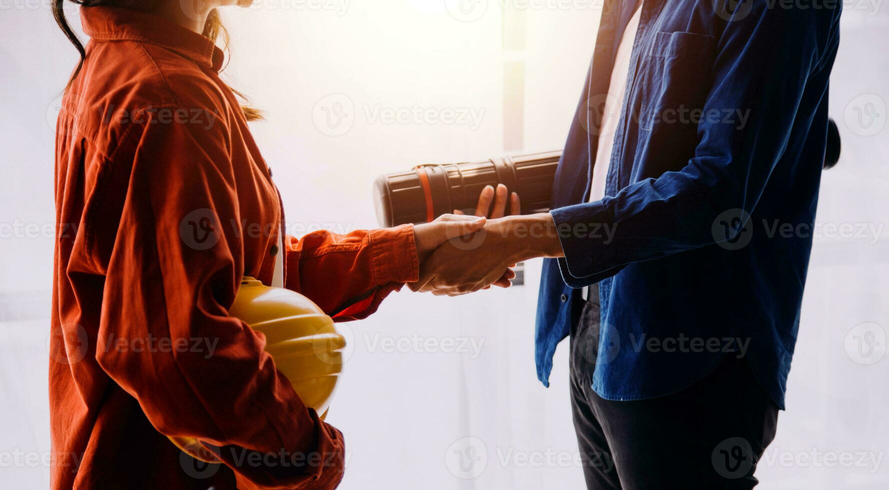 Construction concept of Engineer and Architect working at Construction Site with blue print photo