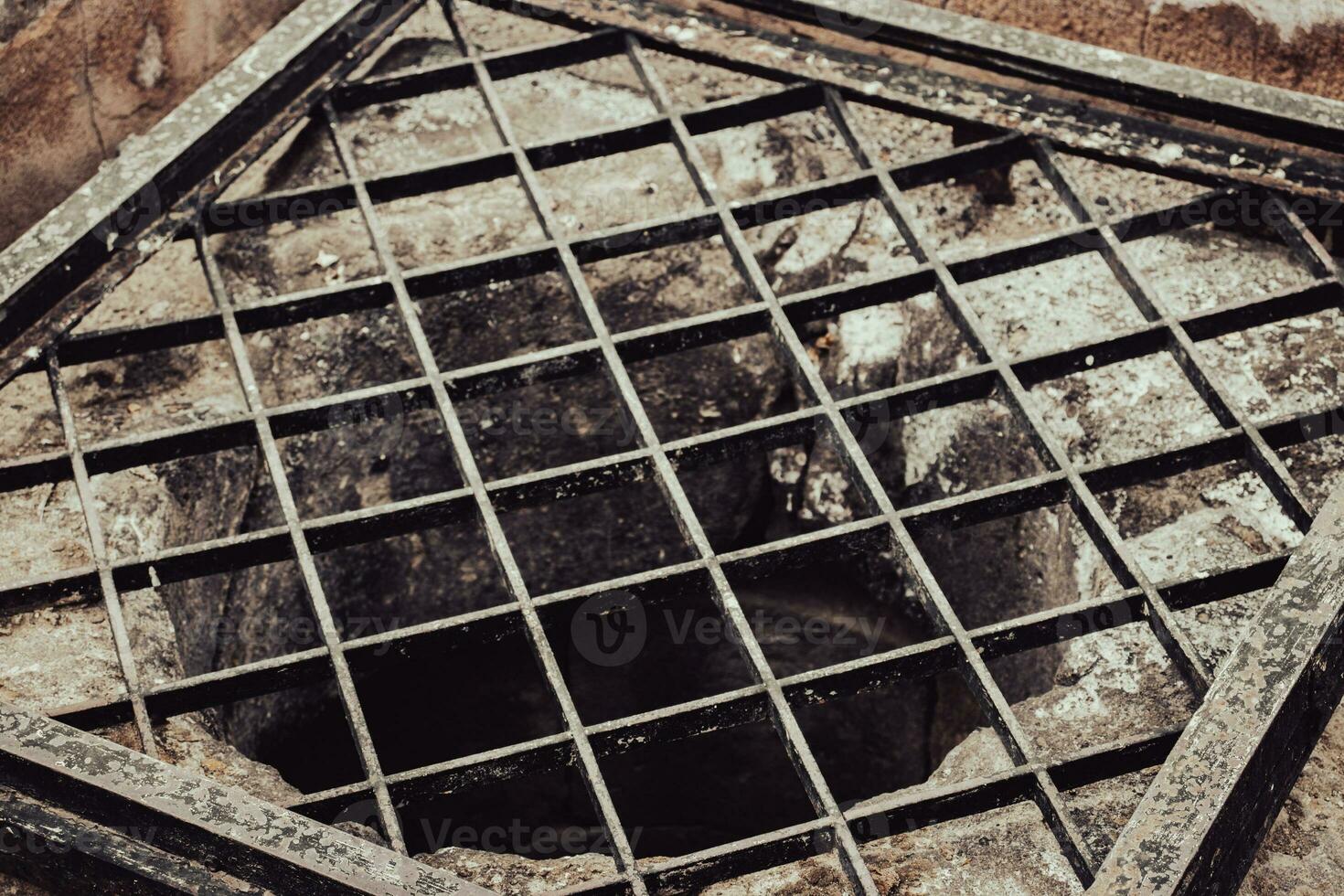 Close up old water well with iron grille close up photo. Street scene. High quality picture for wallpaper, travel blog, magazine, article photo