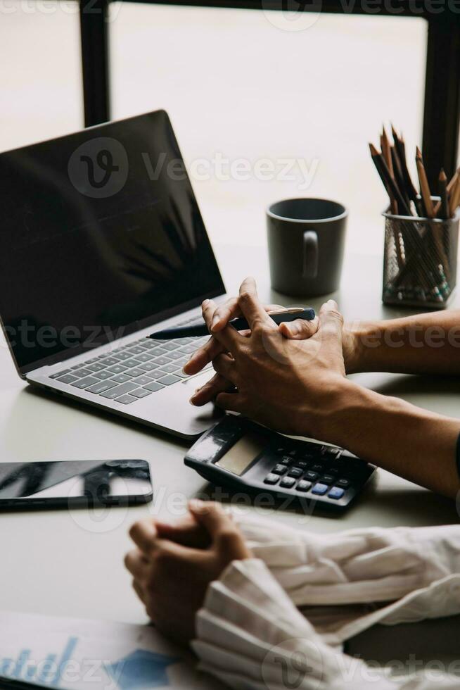 Financial Business team present. Business man hands hold documents with financial statistic stock photo, discussion, and analysis report data the charts and graphs. Finance Financial concept photo