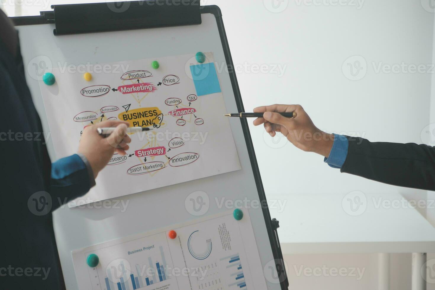 Financial analysts analyze business financial reports on a digital tablet planning investment project during a discussion at a meeting of corporate showing the results of their successful teamwork. photo