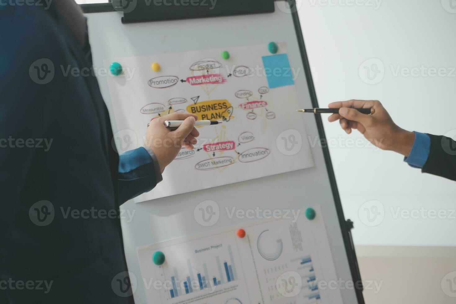 Financial analysts analyze business financial reports on a digital tablet planning investment project during a discussion at a meeting of corporate showing the results of their successful teamwork. photo