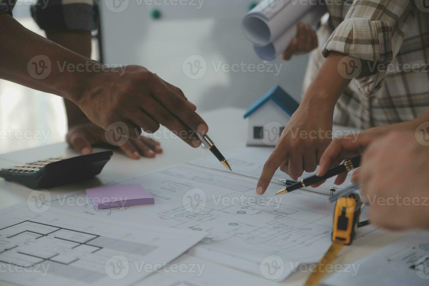 Engineer Teamwork Meeting, Drawing working on blueprint meeting for project working with partner on model building and engineering tools in working site, Construction and structure concept. photo