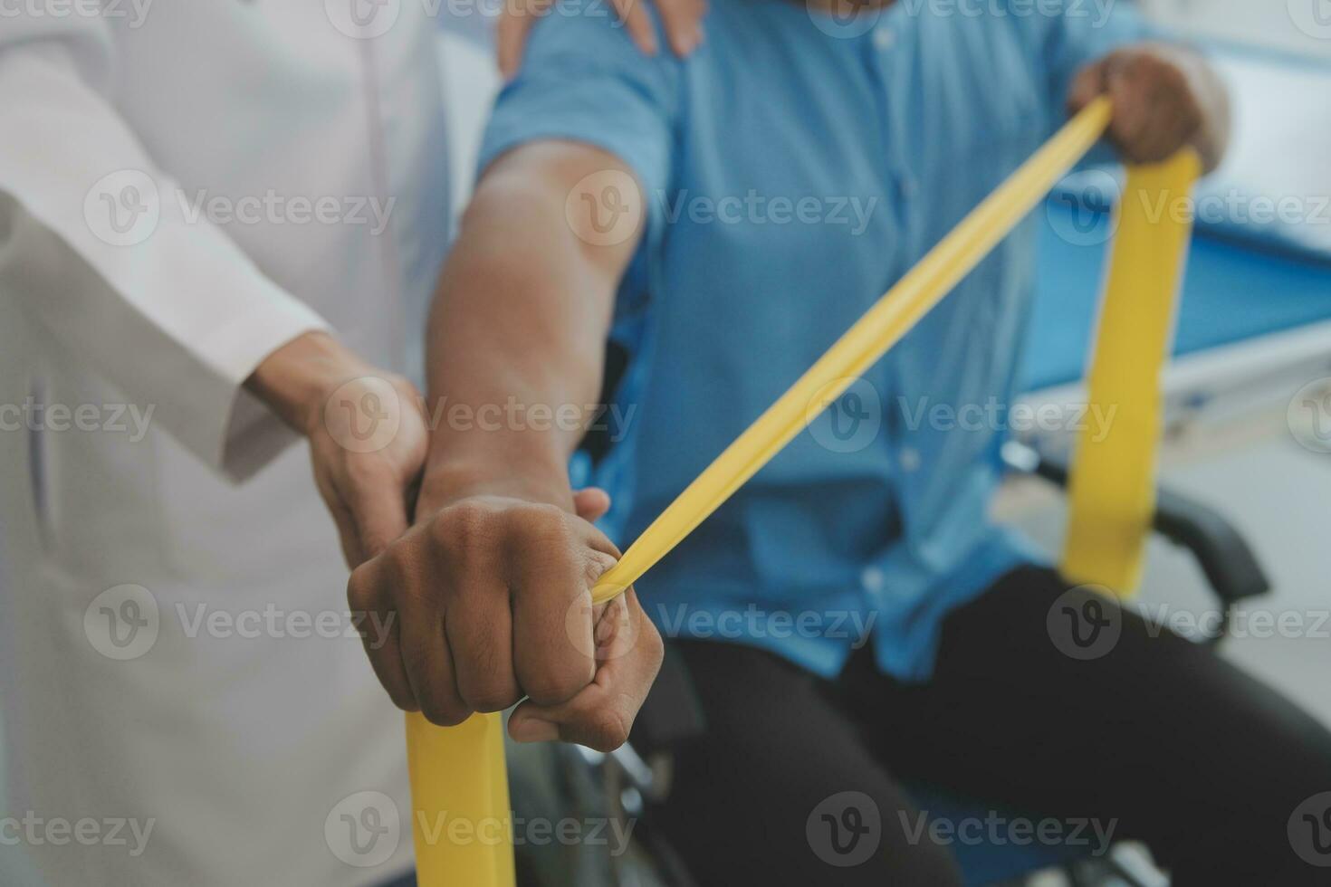 Physiotherapist man giving exercise with dumbbell treatment About Arm and Shoulder of athlete male patient Physical therapy concept photo