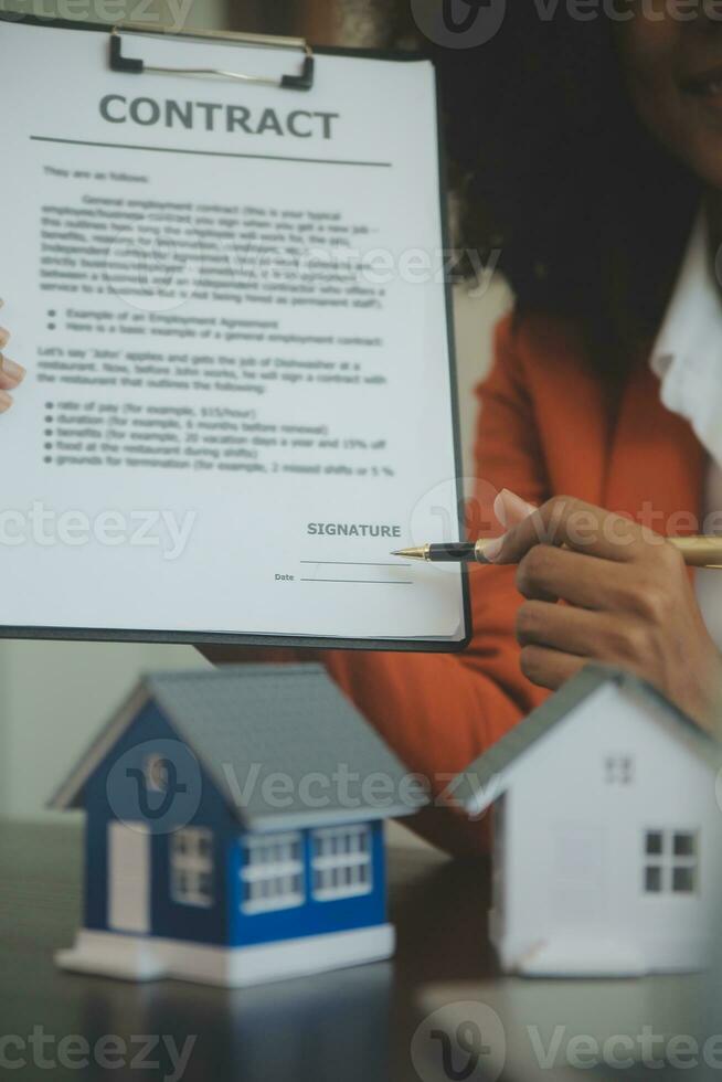Female woman hands holding home model, small miniature white toy house. Mortgage property insurance dream moving home and real estate concept photo