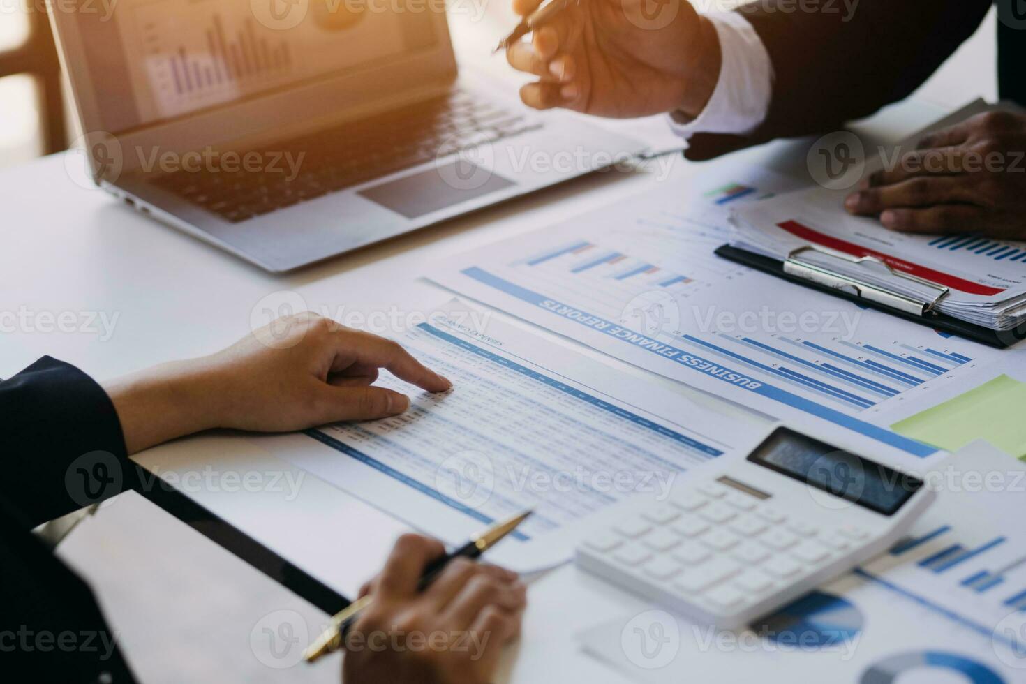 businessman working on desk office with using a calculator to calculate the numbers, finance accounting concept photo