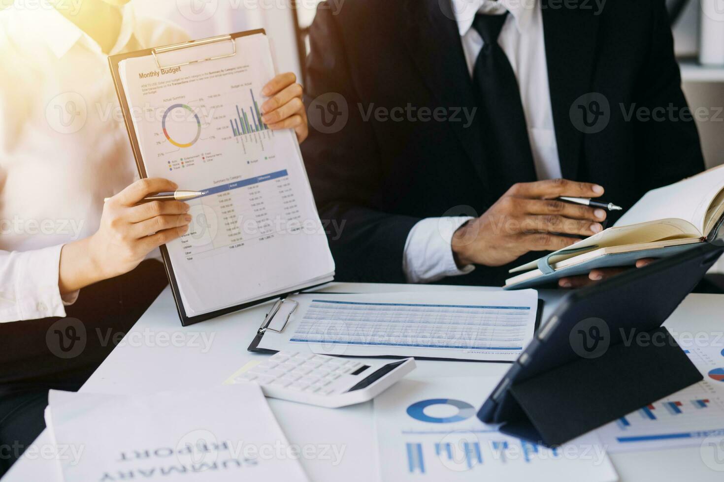 businessman working on desk office with using a calculator to calculate the numbers, finance accounting concept photo