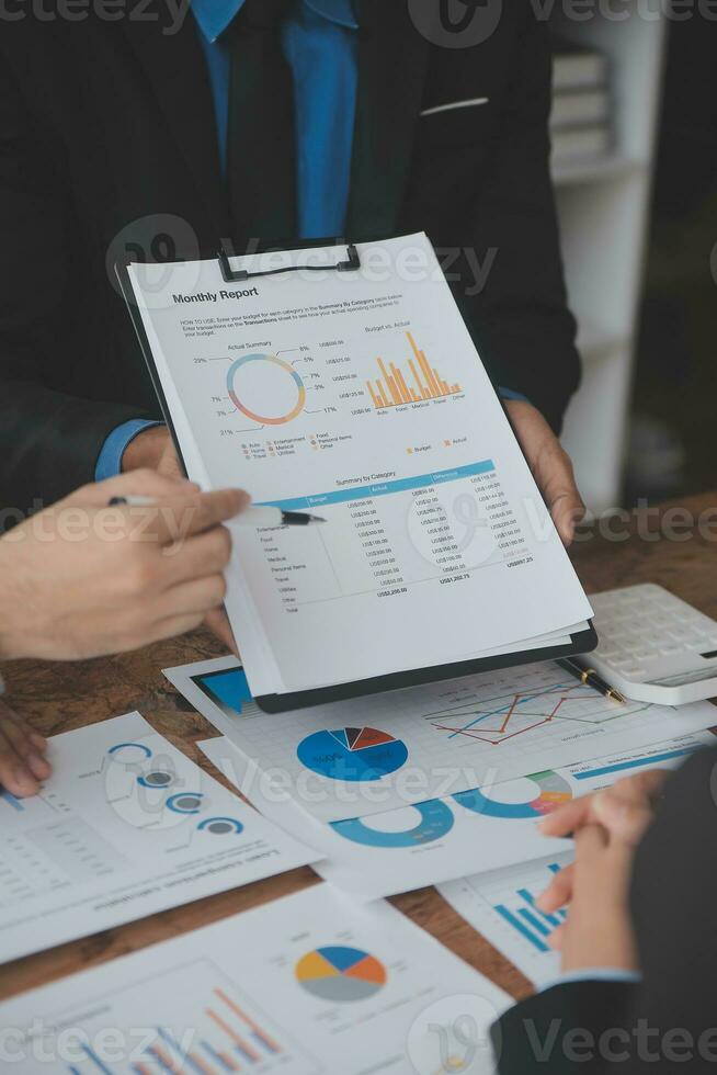 Team of business people working together in the meeting room office, teamwork background charts and graphs banner, double exposure successful teamwork,business planning concept. photo