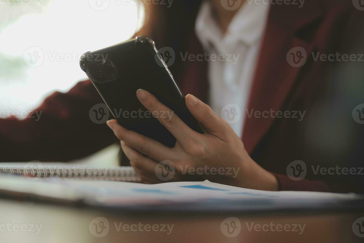 Asian Business woman using calculator and laptop for doing math finance on an office desk, tax, report, accounting, statistics, and analytical research concept photo