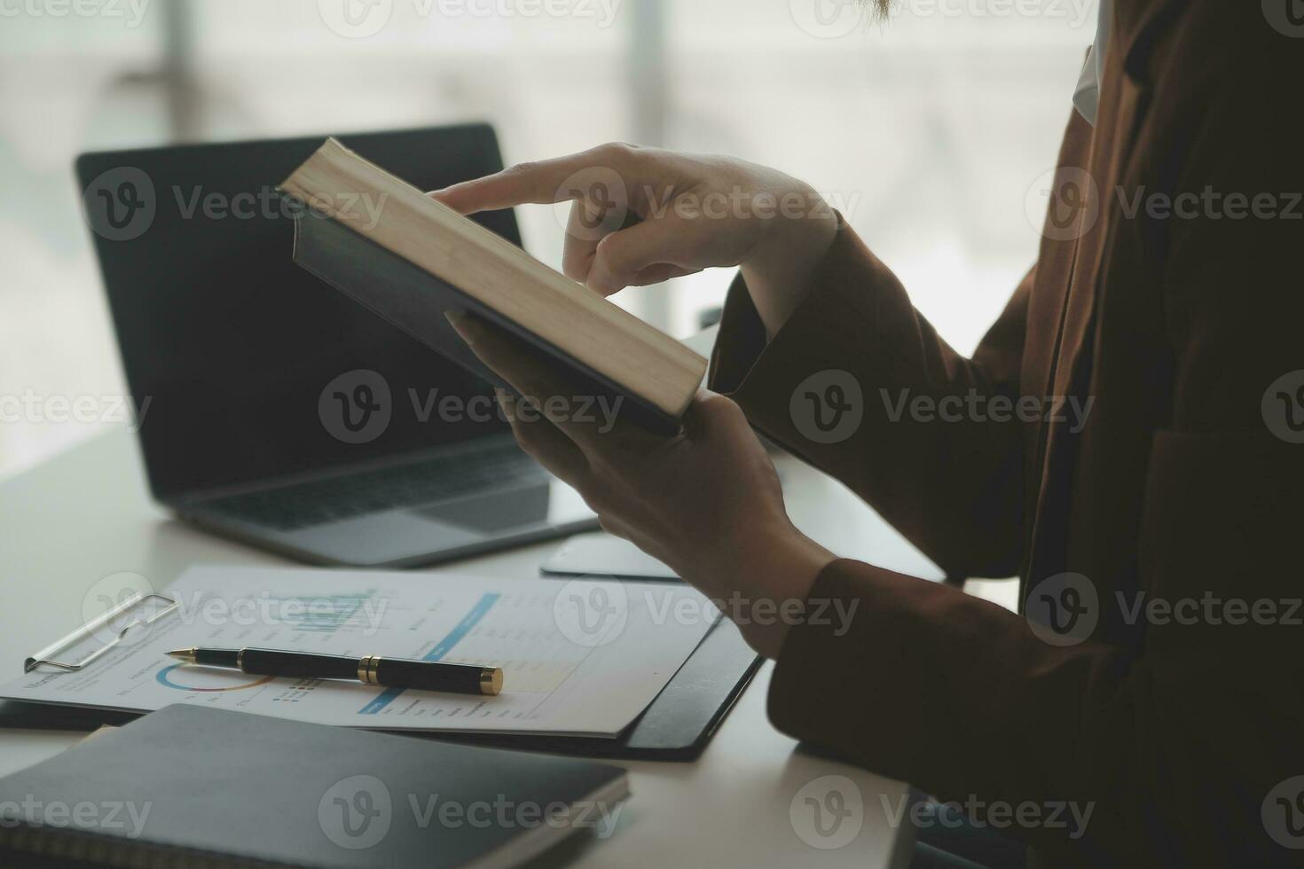 Audit concept,Administrator business man financial inspector and secretary making report calculating balance. Internal Revenue Service checking document. photo
