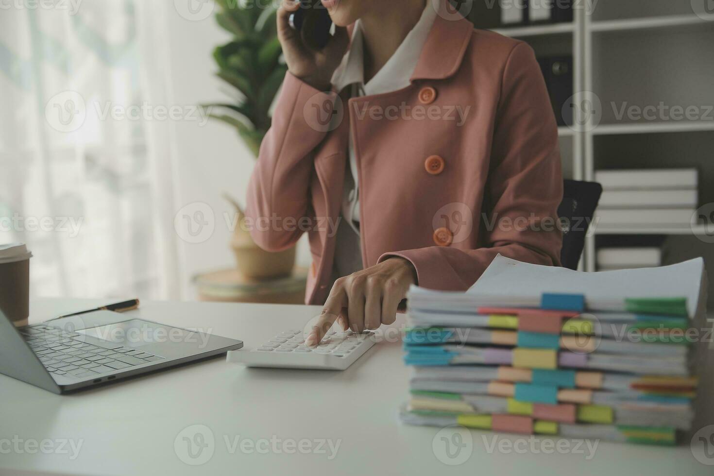 Audit concept,Administrator business man financial inspector and secretary making report calculating balance. Internal Revenue Service checking document. photo