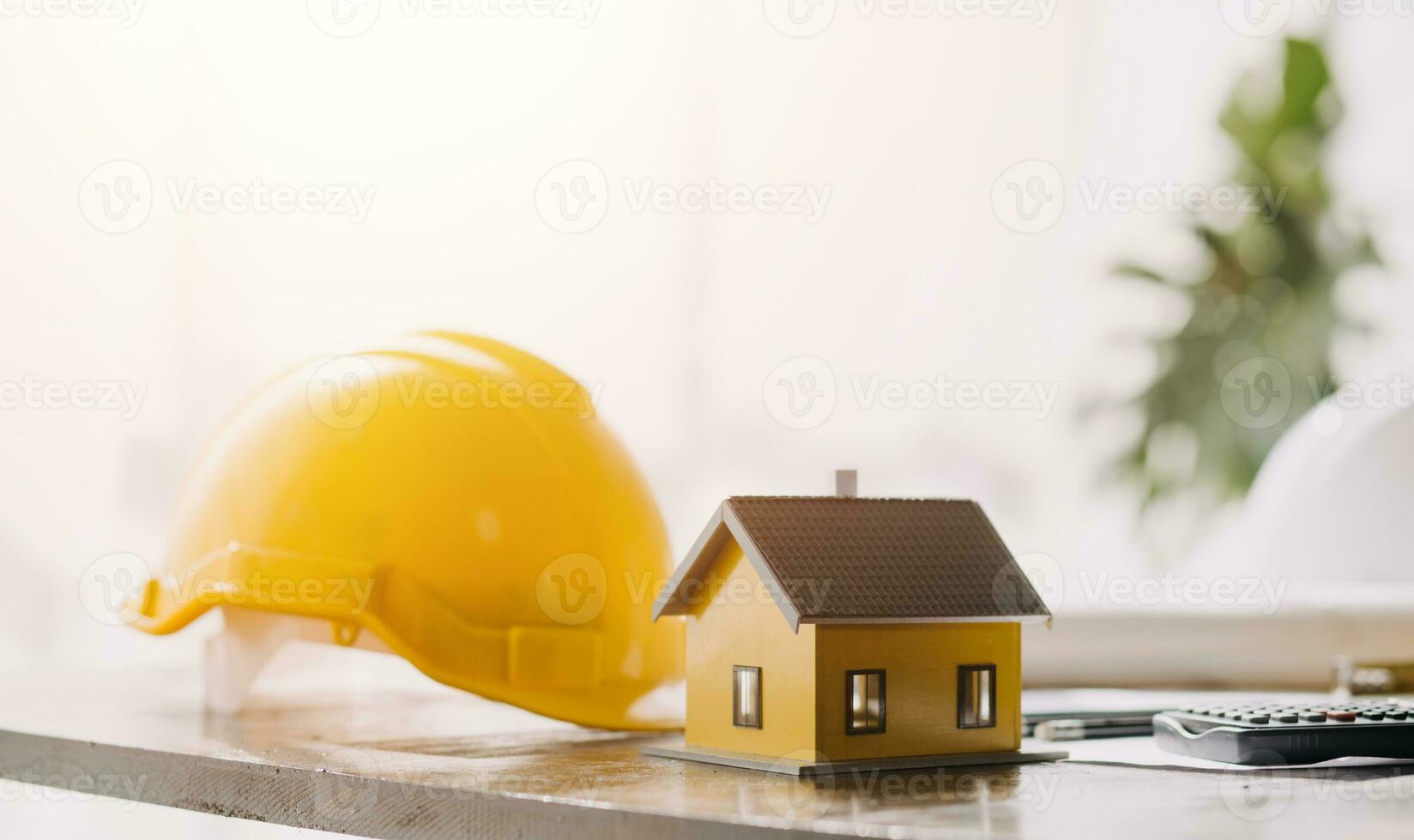 Two Specialists Inspect Commercial, Industrial Building Construction Site. Real Estate Project with Civil Engineer, Investor Use Laptop. In the Background Crane, Skyscraper Concrete Formwork Frames photo