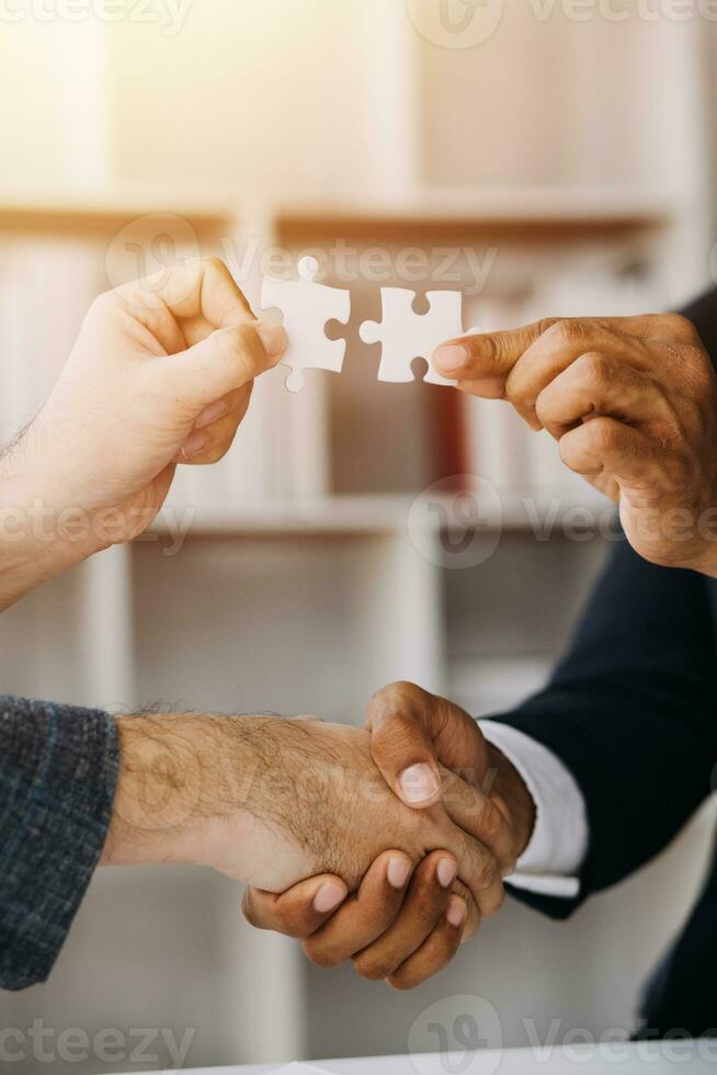 Cropped shot of Businesswoman hand connecting jigsaw puzzle with sunlight effect, Business solutions, success, and Assembling jigsaw pieces, strategy ideas. photo