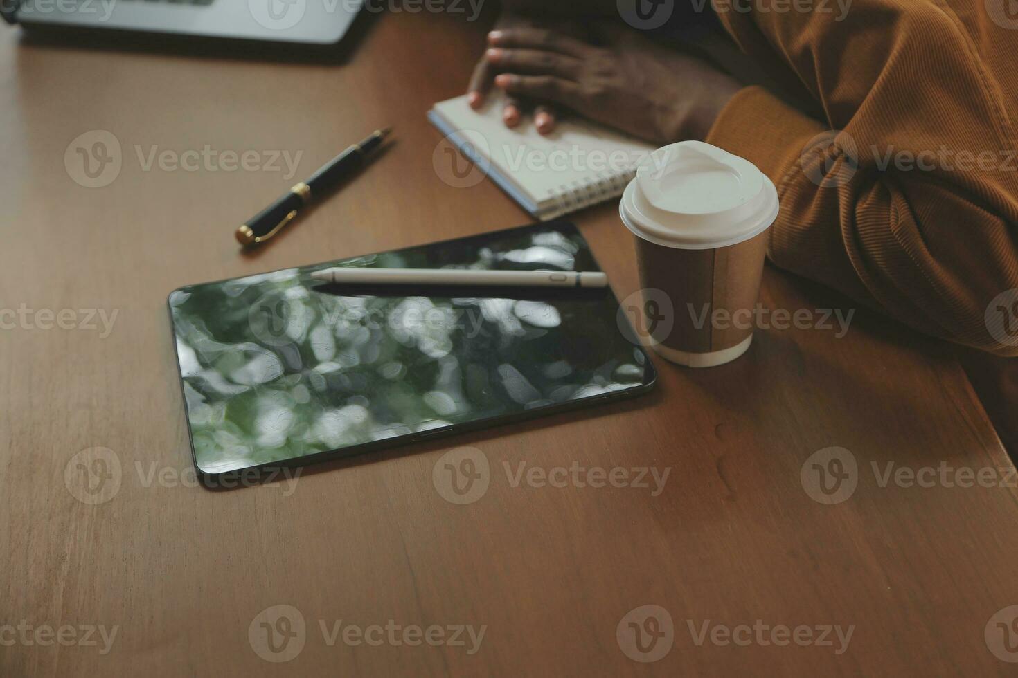 Close up of accountant working and analyzing financial reports project accounting with chart graph and calculator in modern office  finance and business concept. photo