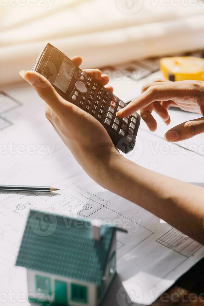 Diverse Team of Specialists Use Tablet Computer on Construction Site. Real Estate Building Project with Civil Engineer, Architect, Business Investor and General Worker Discussing Plan Details. photo