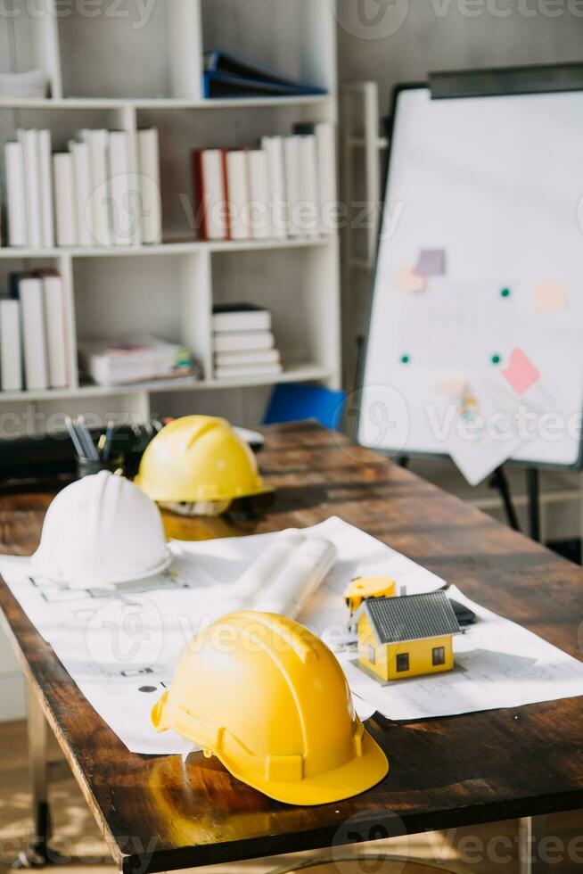 Diverse Team of Specialists Use Tablet Computer on Construction Site. Real Estate Building Project with Civil Engineer, Architect, Business Investor and General Worker Discussing Plan Details. photo