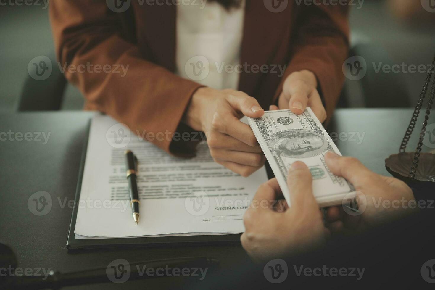 Business and lawyers discussing contract papers with brass scale on desk in office. Law, legal services, advice, justice and law concept picture with film grain effect photo