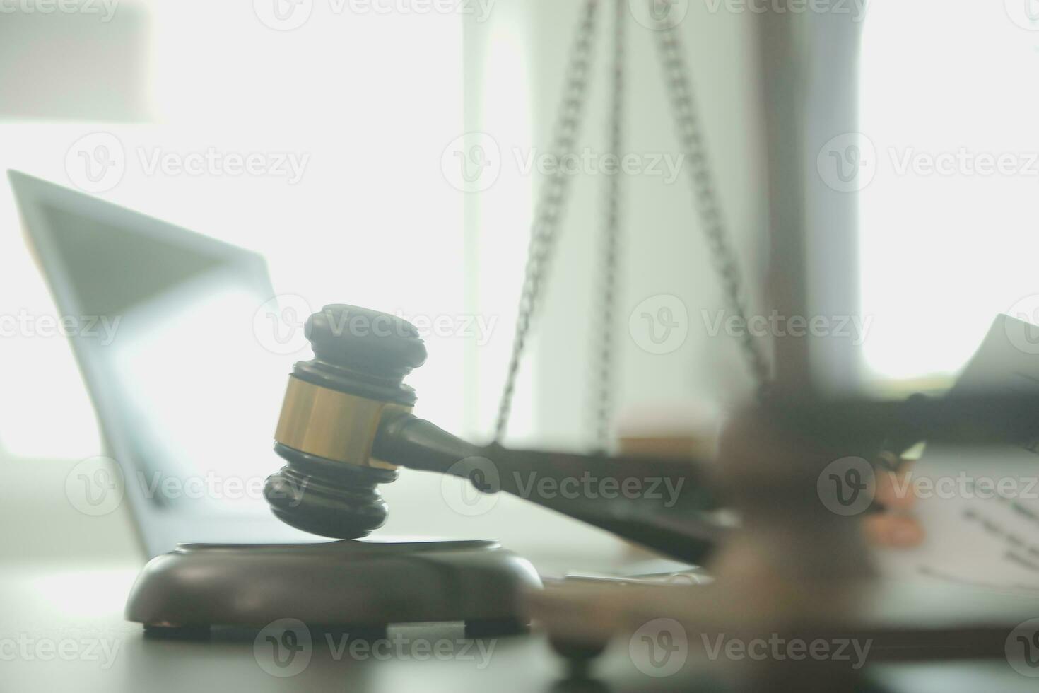 Business and lawyers discussing contract papers with brass scale on desk in office. Law, legal services, advice, justice and law concept picture with film grain effect photo