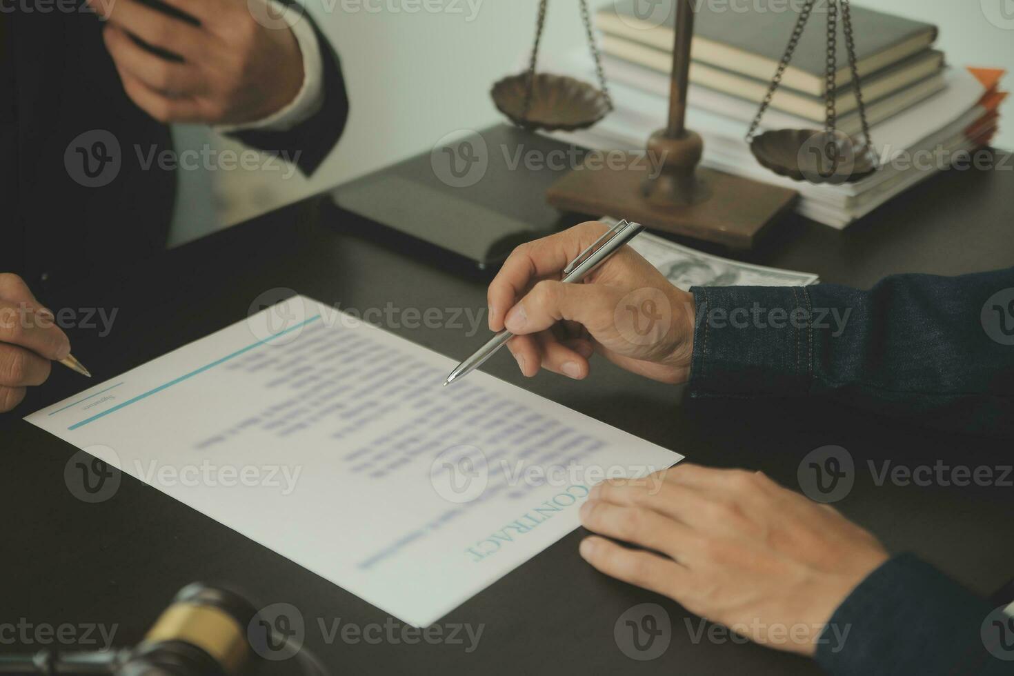Business and lawyers discussing contract papers with brass scale on desk in office. Law, legal services, advice, justice and law concept picture with film grain effect photo