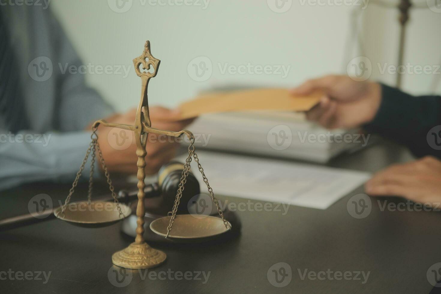 Business and lawyers discussing contract papers with brass scale on desk in office. Law, legal services, advice, justice and law concept picture with film grain effect photo