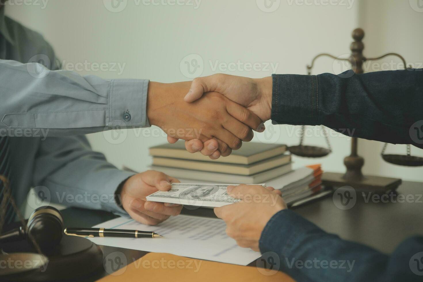 Business and lawyers discussing contract papers with brass scale on desk in office. Law, legal services, advice, justice and law concept picture with film grain effect photo