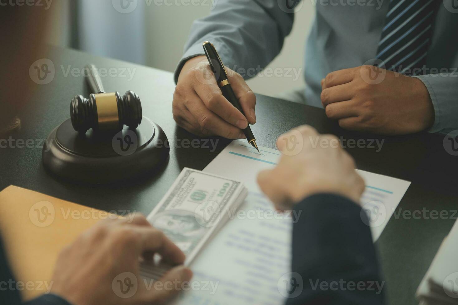 Business and lawyers discussing contract papers with brass scale on desk in office. Law, legal services, advice, justice and law concept picture with film grain effect photo