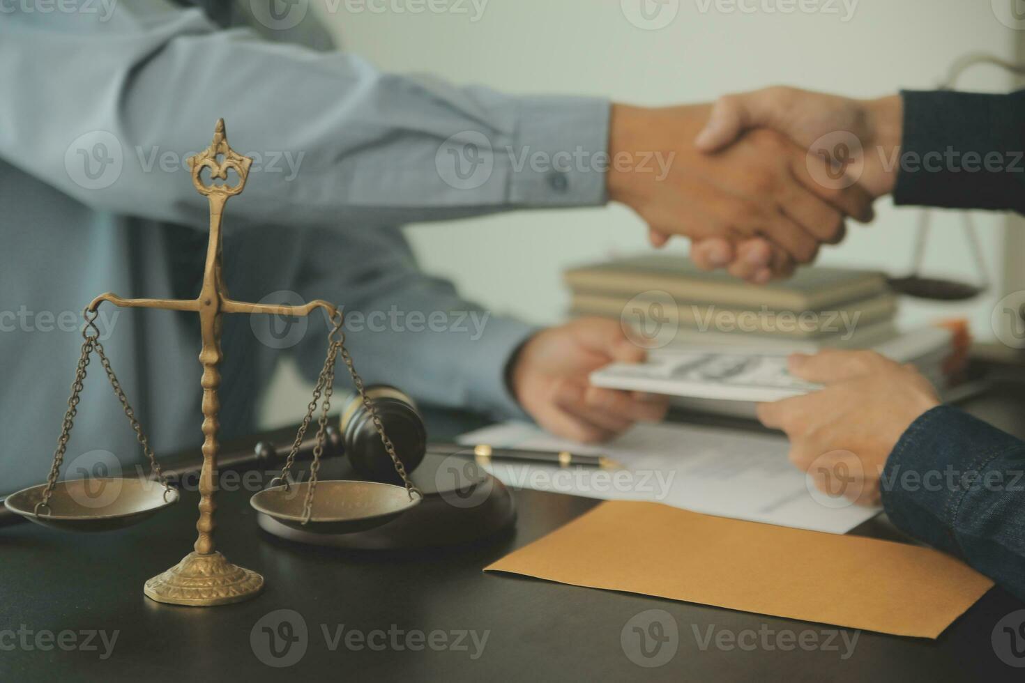 Business and lawyers discussing contract papers with brass scale on desk in office. Law, legal services, advice, justice and law concept picture with film grain effect photo