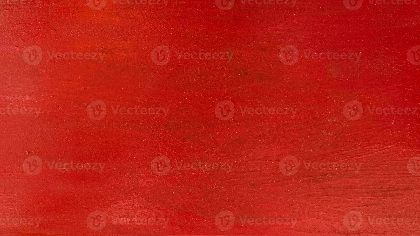 close up of red painted wooden surface texture for background photo
