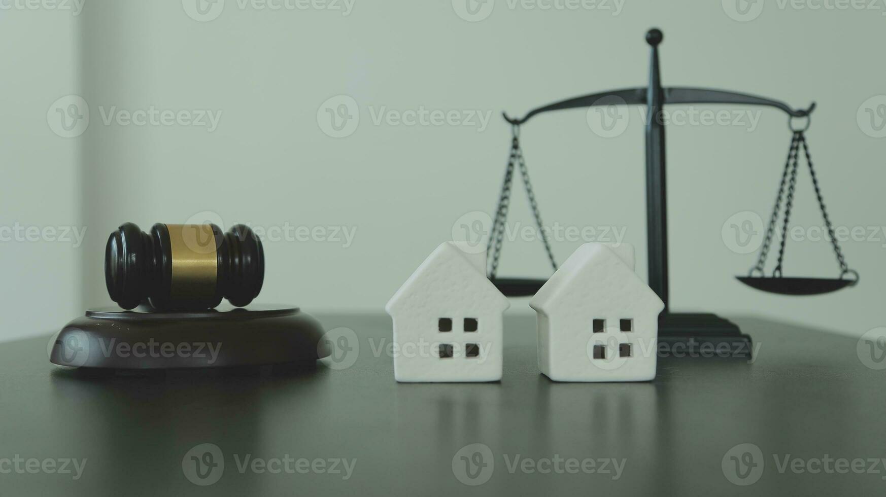 Justice and law concept.Male judge in a courtroom with the gavel, working with, computer and docking keyboard, eyeglasses, on table in morning light photo