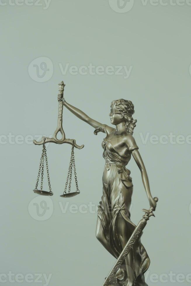 Justice and law concept.Male judge in a courtroom with the gavel, working with, computer and docking keyboard, eyeglasses, on table in morning light photo