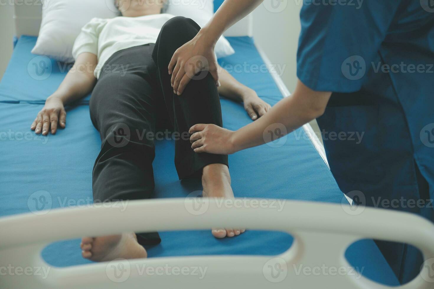 Physiotherapist working with patient in clinic, closeup photo