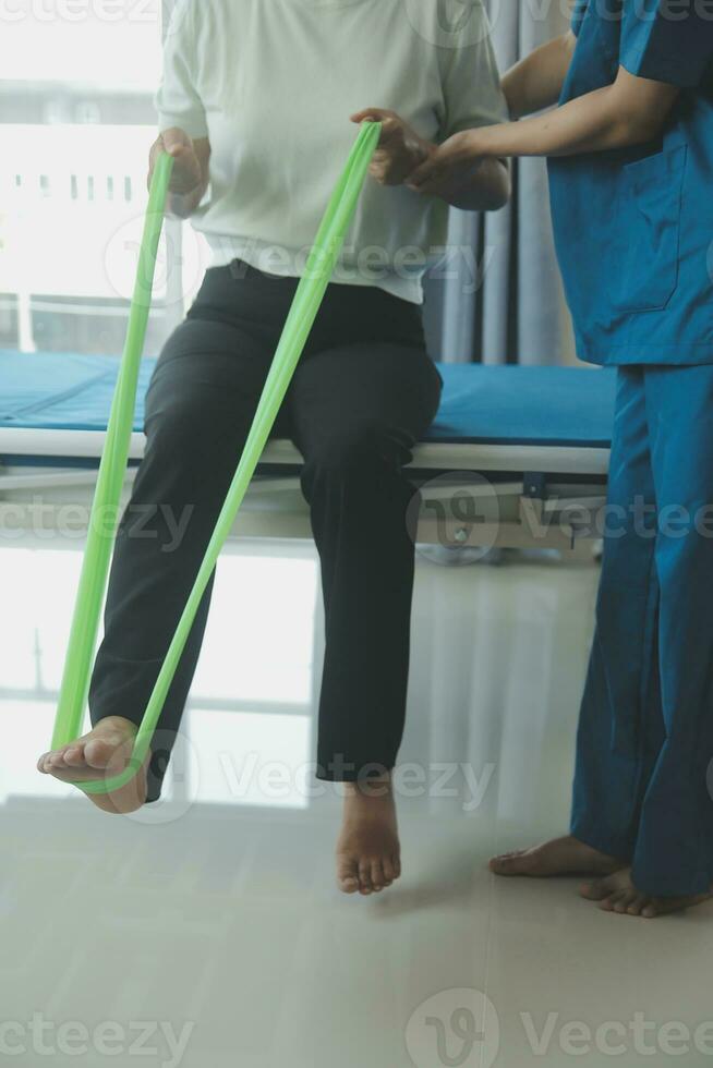 Physiotherapist working with patient in clinic, closeup photo