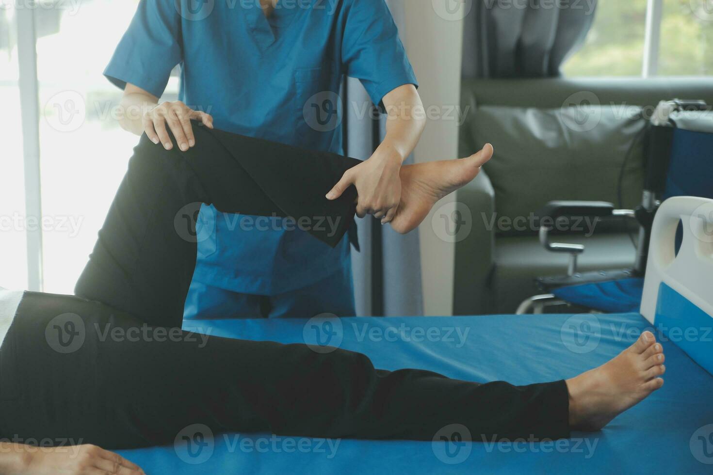 Physiotherapist working with patient in clinic, closeup photo
