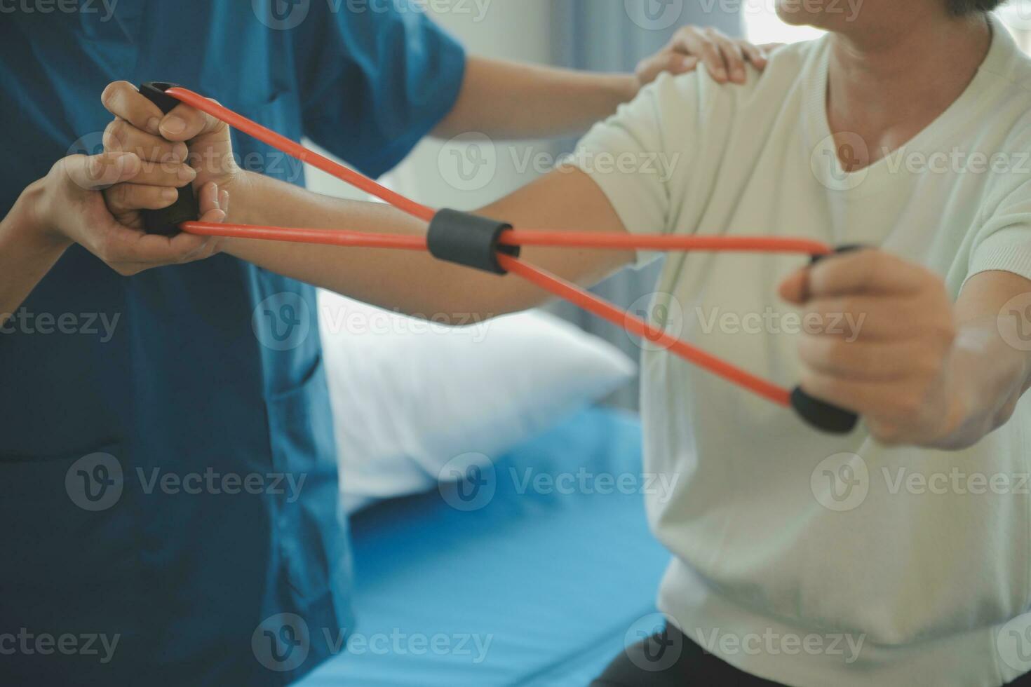 Patient doing some special exercises under supervision in a room photo