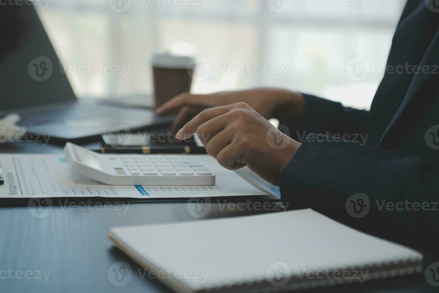 Young adult happy smiling Hispanic Asian student wearing headphones talking on online chat meeting using laptop in university campus or at virtual office. College female student learning remotely. photo