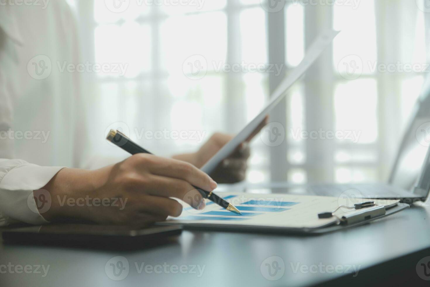 Audit concept,Administrator business man financial inspector and secretary making report calculating balance. Internal Revenue Service checking document. photo