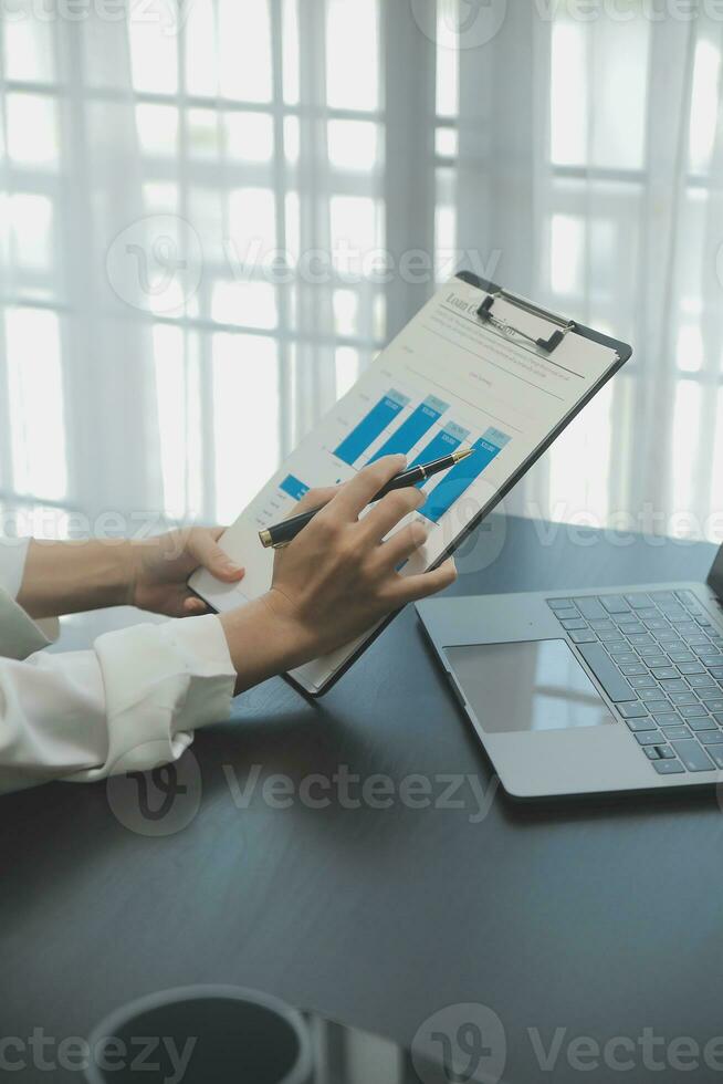 Audit concept,Administrator business man financial inspector and secretary making report calculating balance. Internal Revenue Service checking document. photo