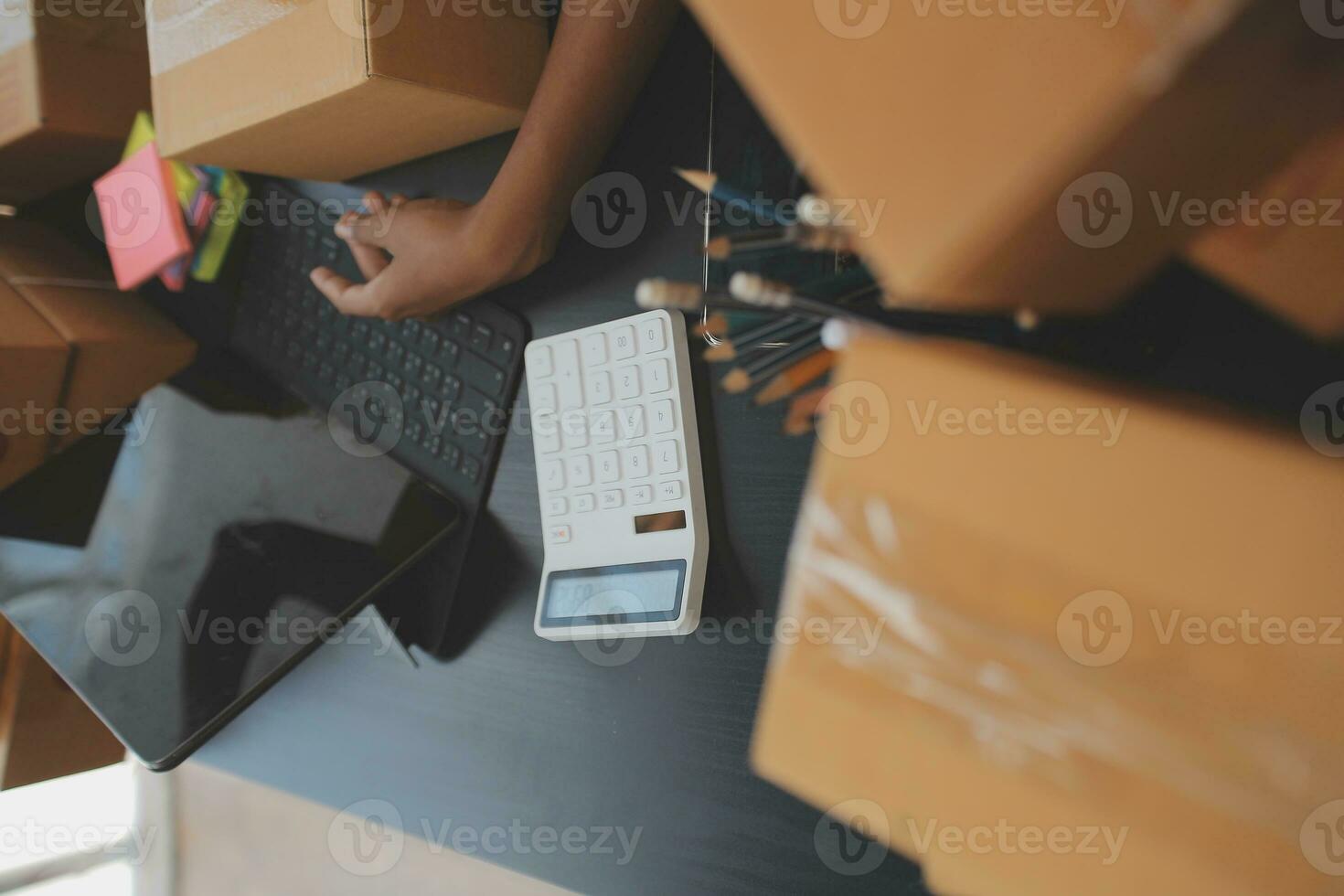 Business woman start up small business entrepreneur SME success .freelance woman working at home with Online Parcel delivery. SME and packaging deliveryconcept photo