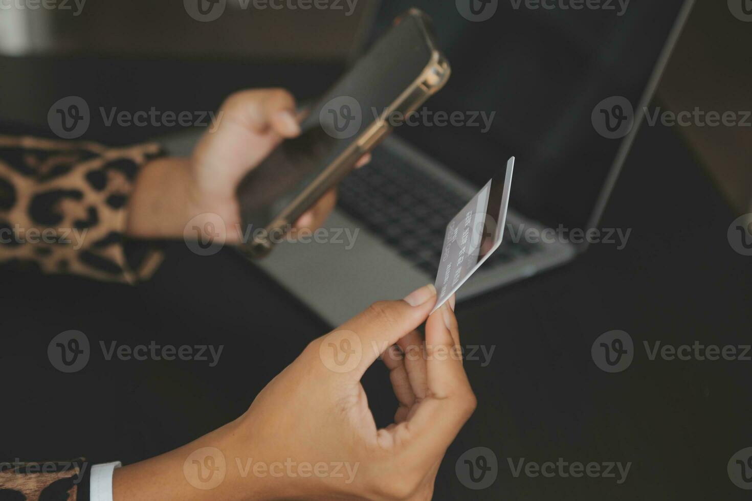 Women holding credit card and using smartphones at home.Online shopping, internet banking, store online, payment, spending money, e-commerce payment at the store, credit card, concept photo