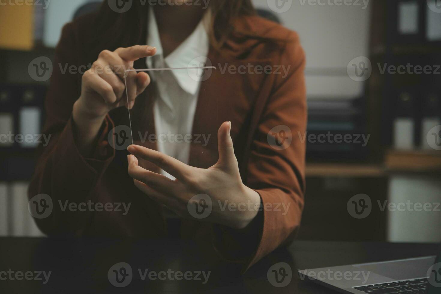 Shot of a asian young business Female working on laptop in her workstation. photo