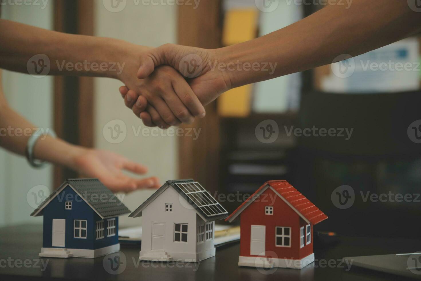 Female woman hands holding home model, small miniature white toy house. Mortgage property insurance dream moving home and real estate concept photo