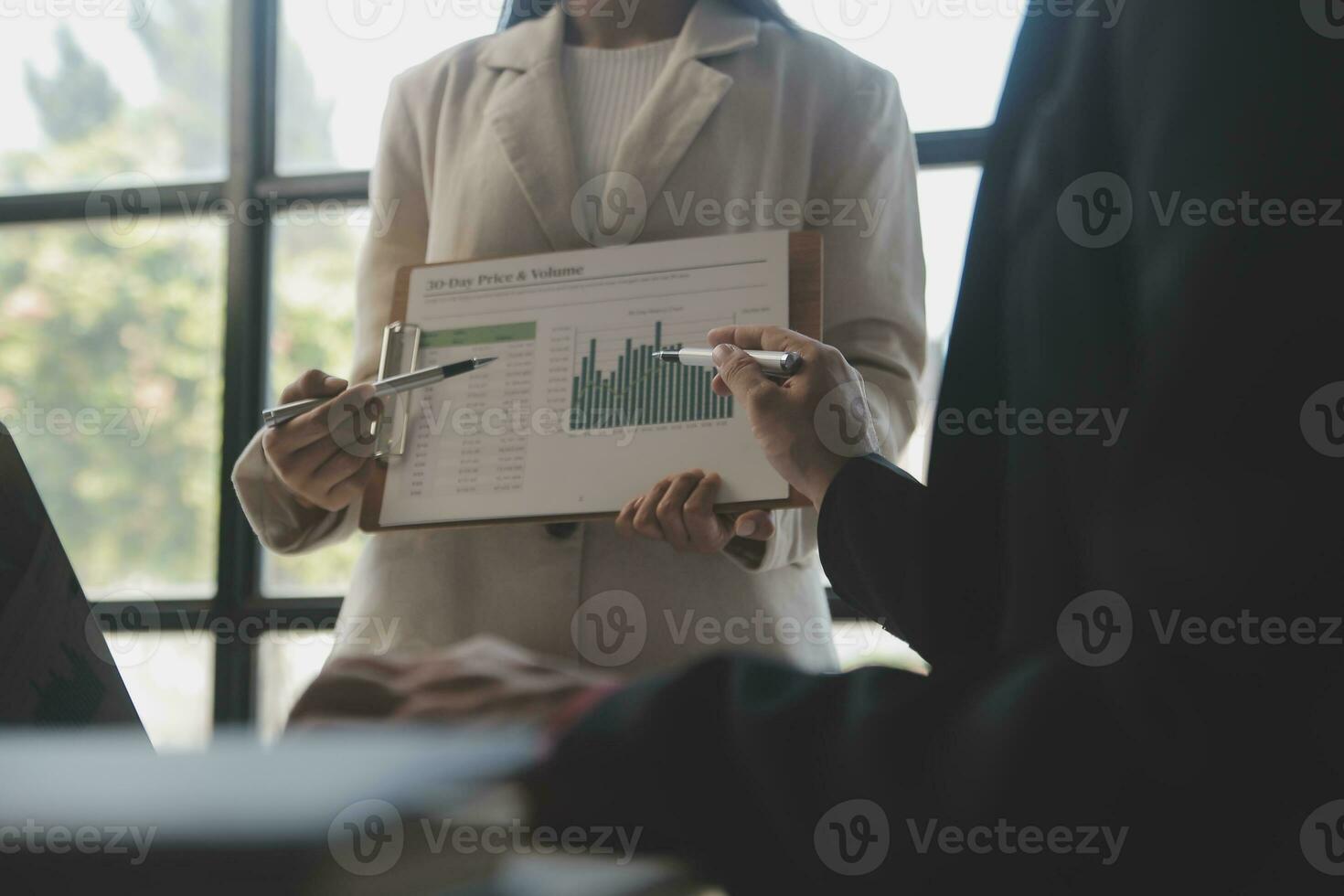 Shot of a asian young business Female working on laptop in her workstation. photo