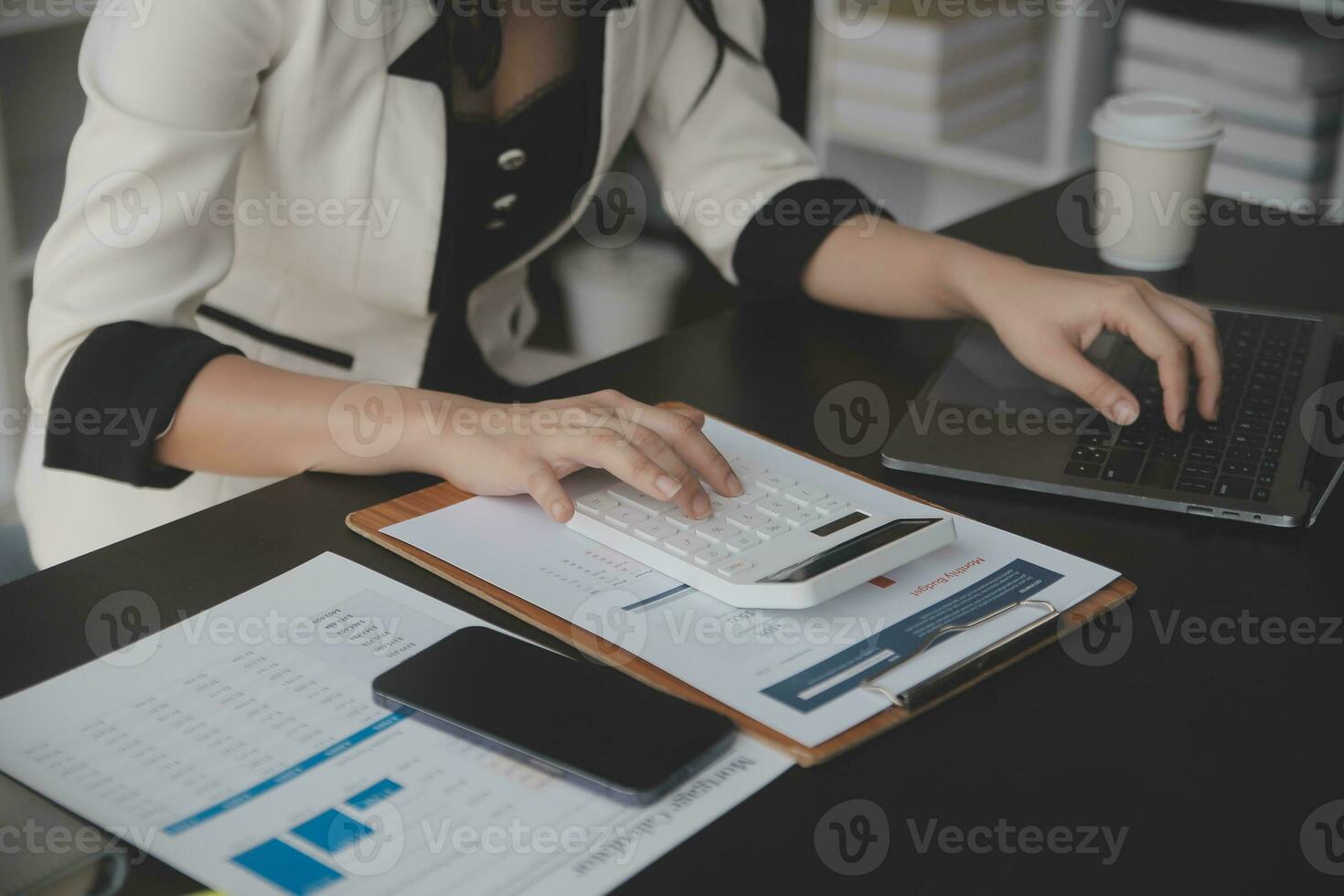Audit concept,Administrator business man financial inspector and secretary making report calculating balance. Internal Revenue Service checking document. photo