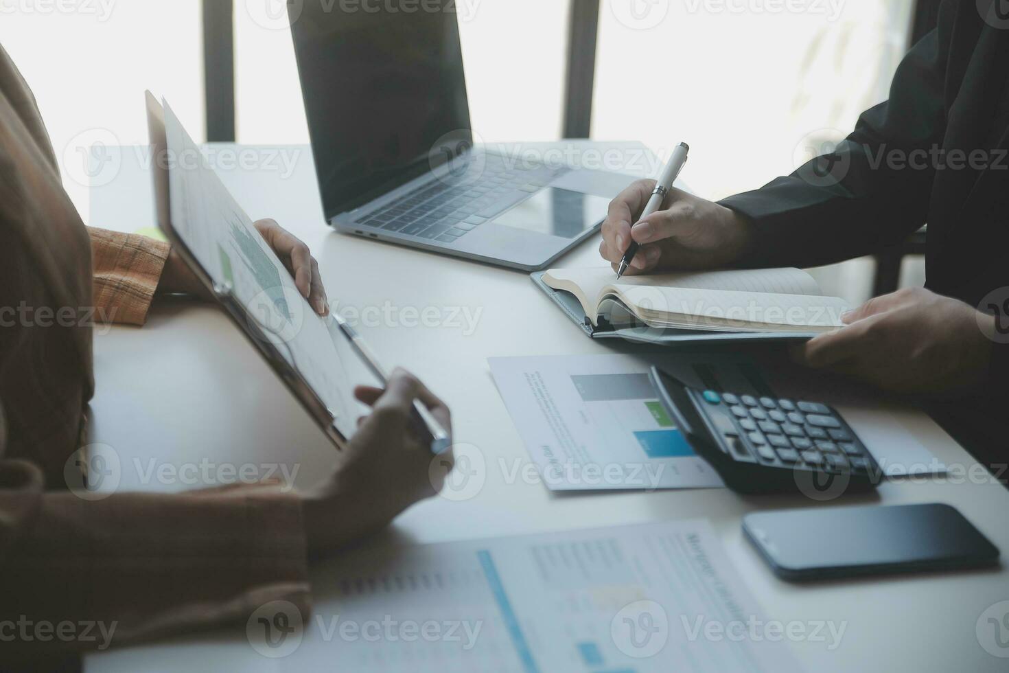 Audit concept,Administrator business man financial inspector and secretary making report calculating balance. Internal Revenue Service checking document. photo