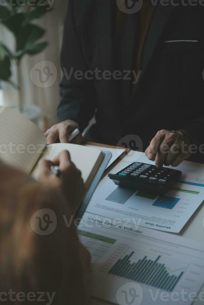 Audit concept,Administrator business man financial inspector and secretary making report calculating balance. Internal Revenue Service checking document. photo