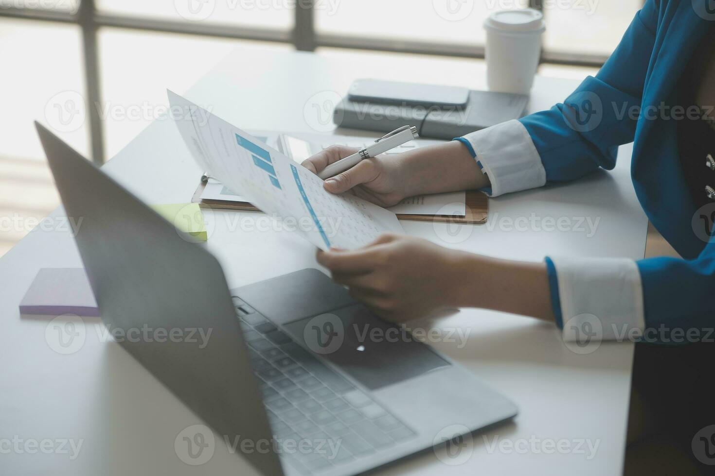 Audit concept,Administrator business man financial inspector and secretary making report calculating balance. Internal Revenue Service checking document. photo