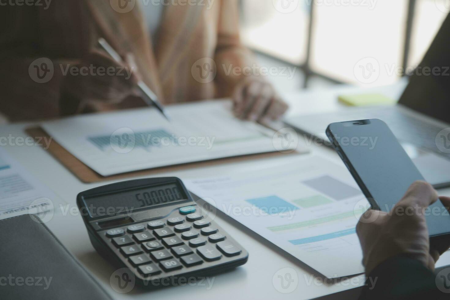 Audit concept,Administrator business man financial inspector and secretary making report calculating balance. Internal Revenue Service checking document. photo