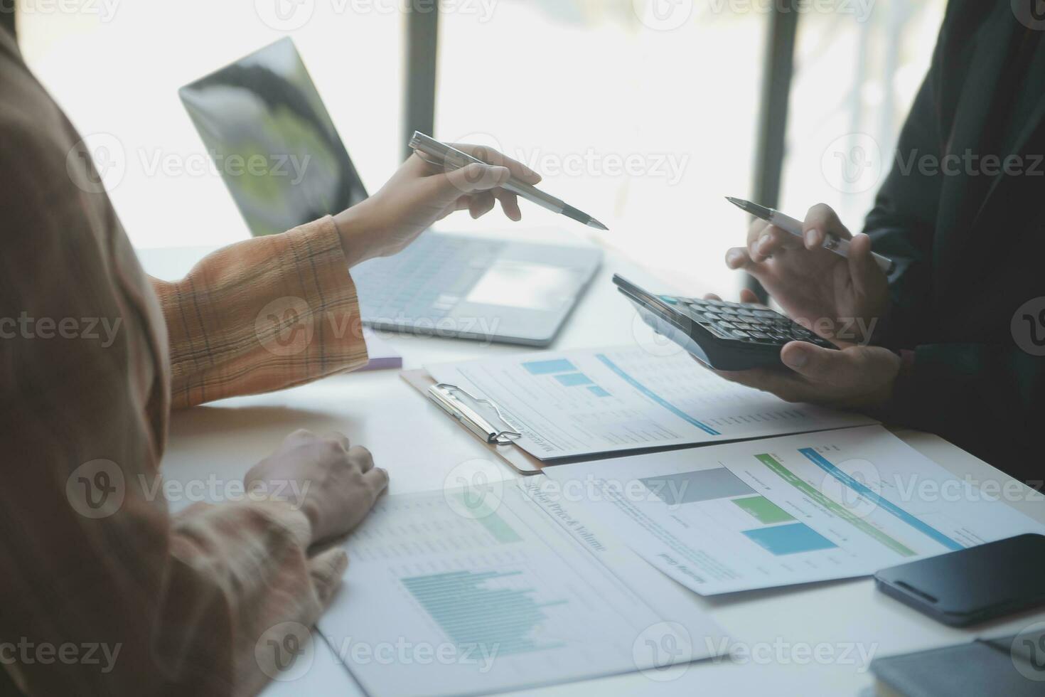 Audit concept,Administrator business man financial inspector and secretary making report calculating balance. Internal Revenue Service checking document. photo
