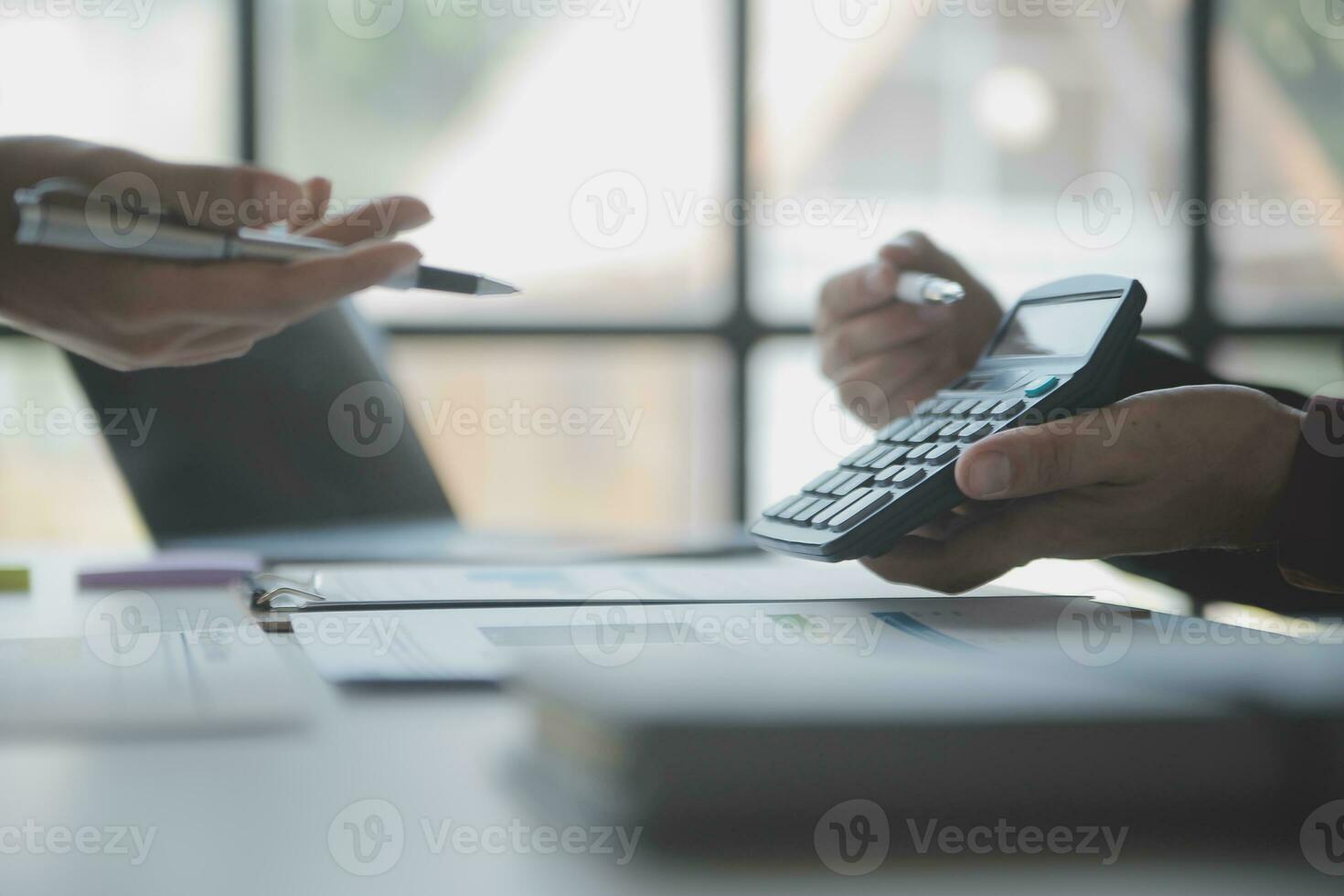 Audit concept,Administrator business man financial inspector and secretary making report calculating balance. Internal Revenue Service checking document. photo