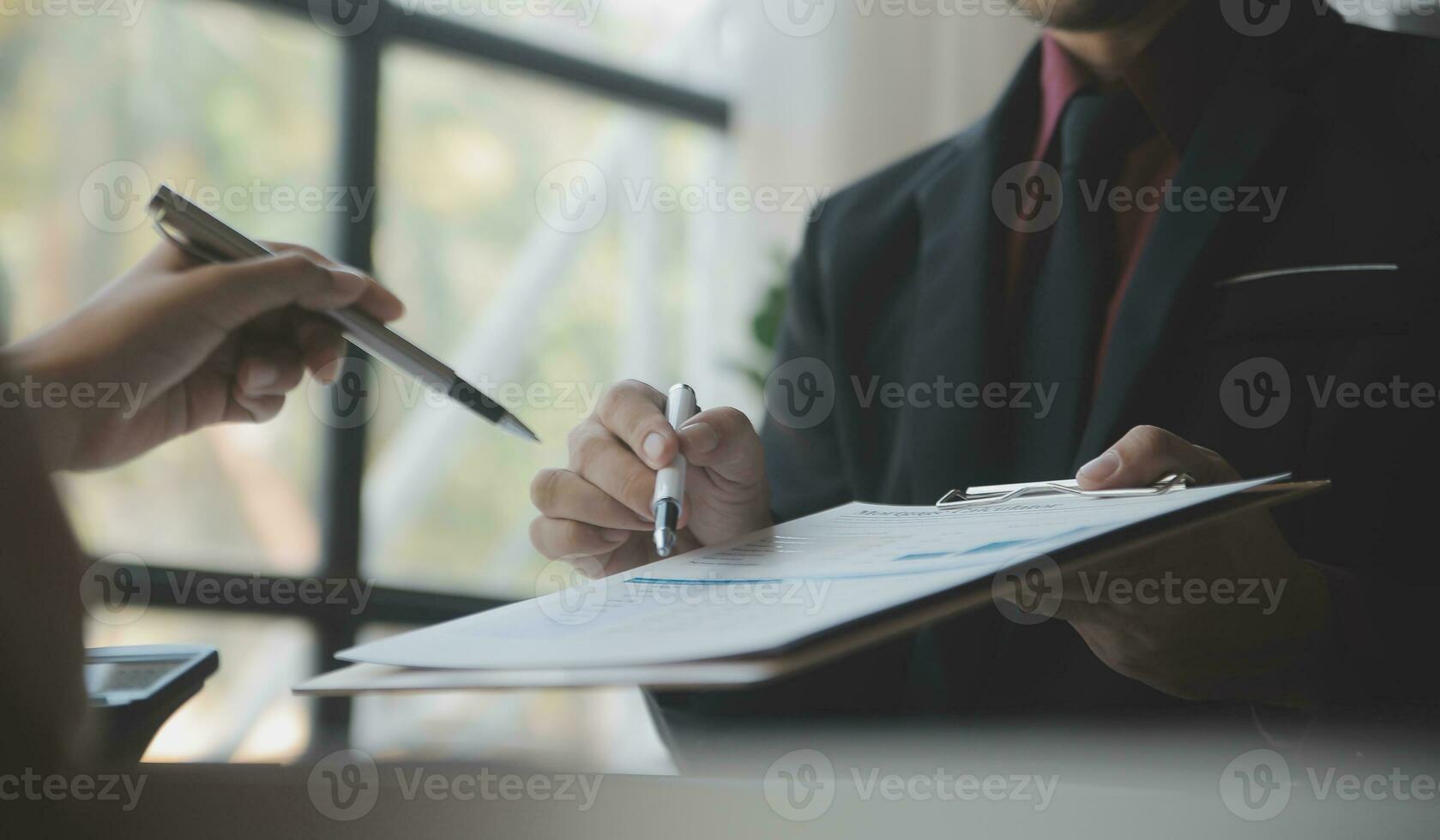 Audit concept,Administrator business man financial inspector and secretary making report calculating balance. Internal Revenue Service checking document. photo