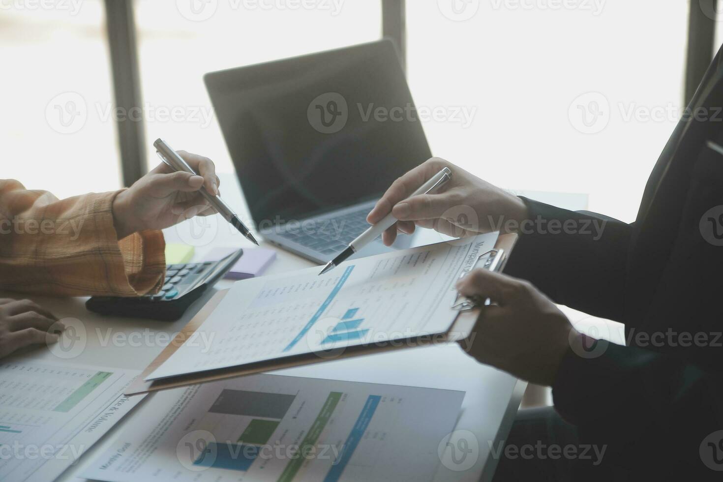 Audit concept,Administrator business man financial inspector and secretary making report calculating balance. Internal Revenue Service checking document. photo